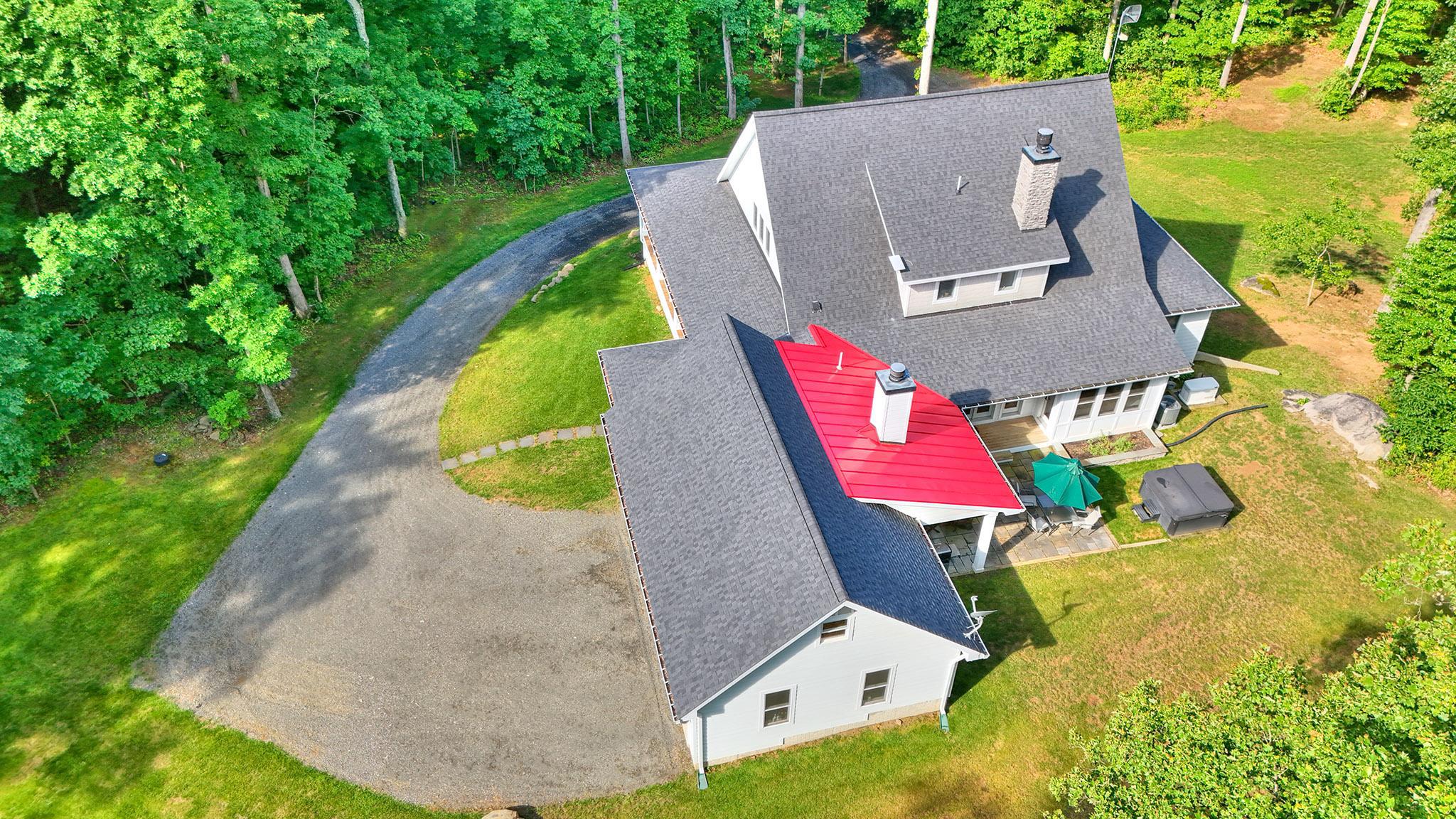3411 Fenny Hill Road Delaplane, VA 20144 - Photo 61 of 75 Outdoor stone fireplace chimney thru red roof