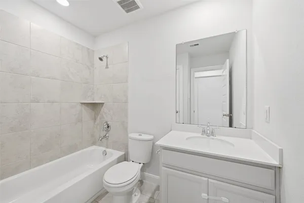 a bathroom with a sink toilet and bathtub
