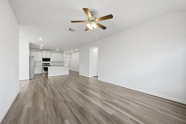 a view of kitchen with cabinets and wooden floor