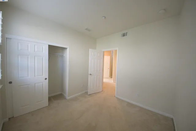 a bathroom with a shower and a glass door