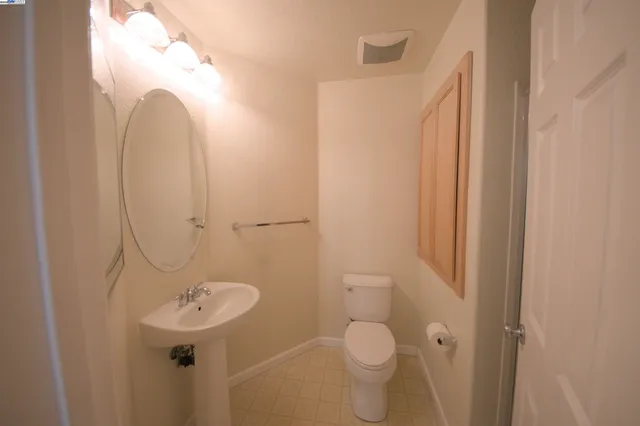 a view of a room with lots of windows and chandelier