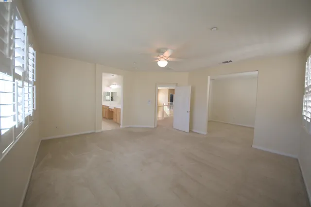 an empty room that has window in it