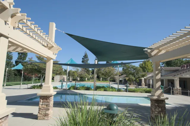 a view of a swimming pool with a patio