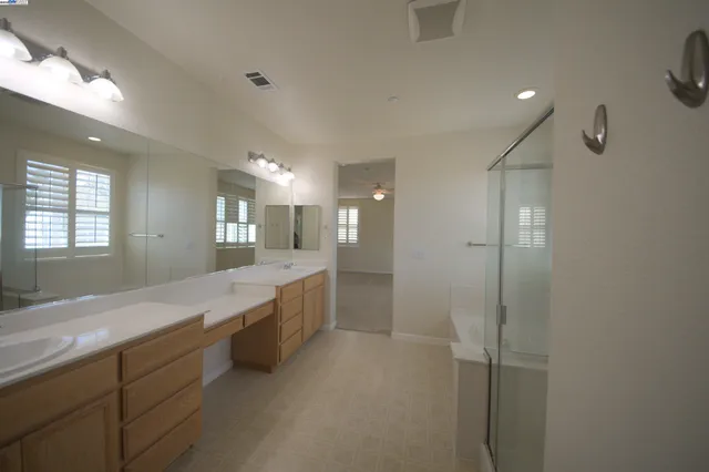 a view of a hallway with closet and a couch