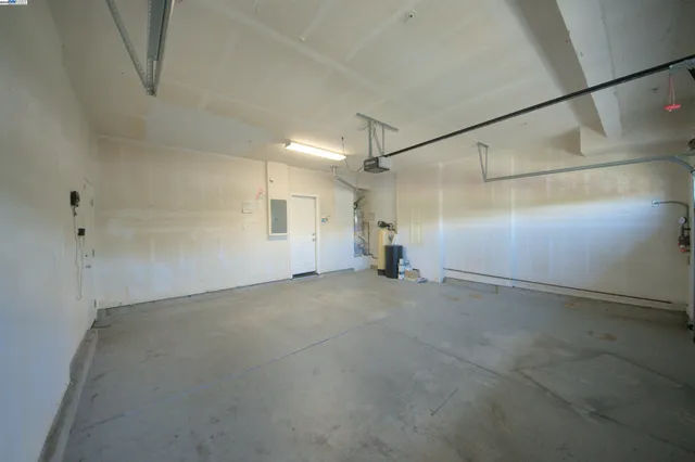 a view of house with yard and sitting area