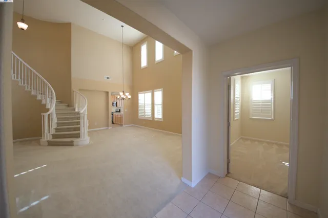a view of an empty room with a fireplace