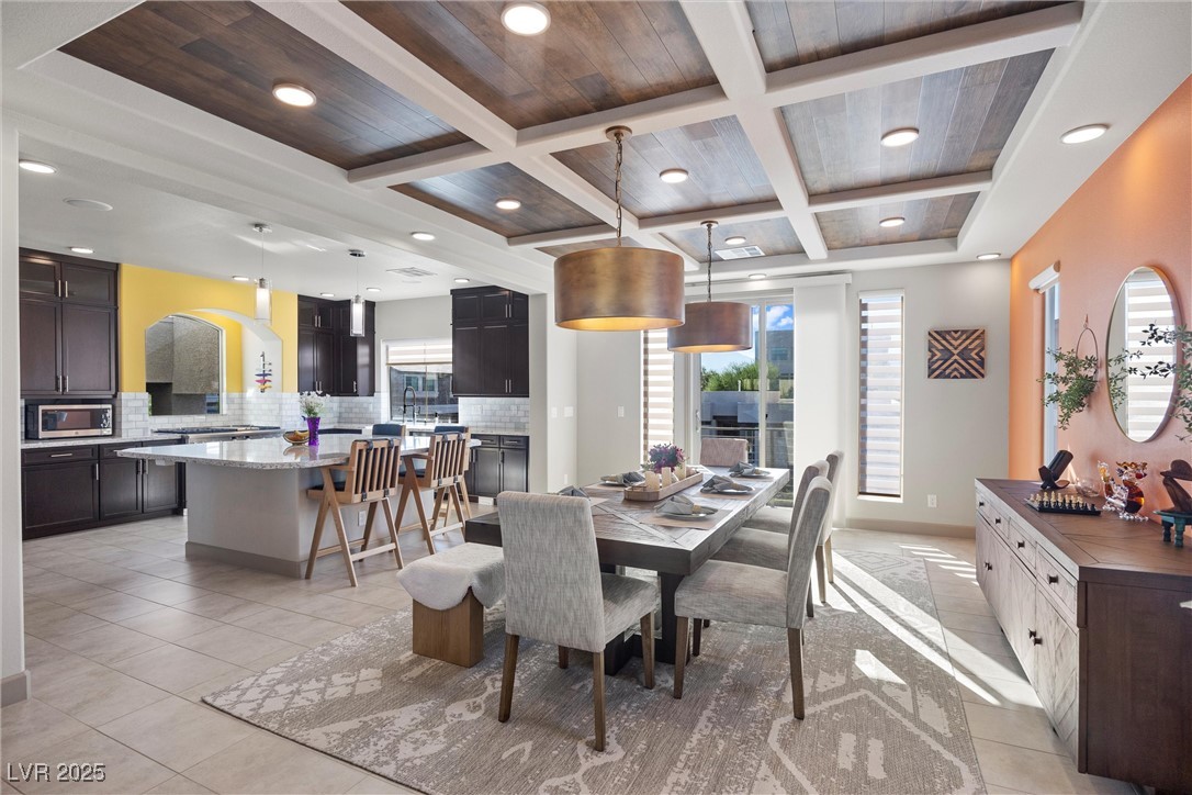 Large Formal Dining with Custom Light Fixtures and Inlaid Wood Ceiling