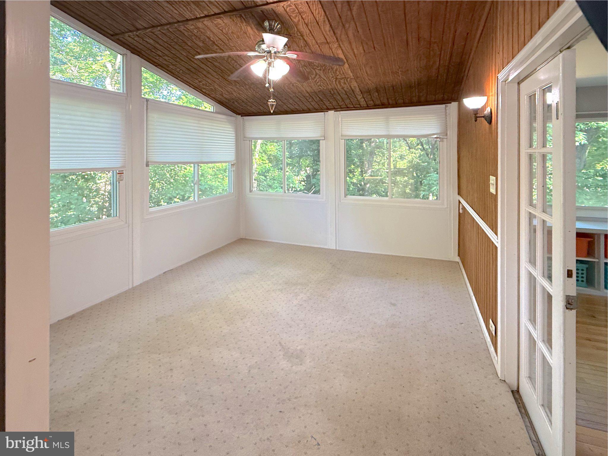 9006 Sidehill Road Ellicott City, MD 21042 - Photo 7 of 53 Serene sunlit retreat with nature views.