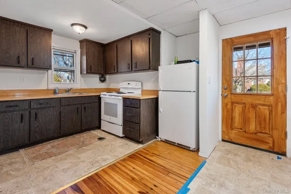 a kitchen with stainless steel appliances granite countertop a refrigerator sink and cabinets