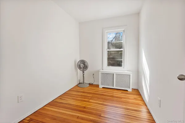 a view of a room with wooden floor and sink