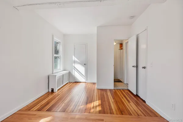 a view of wooden floor in an empty room