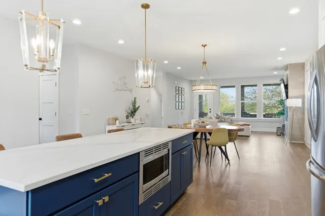 a kitchen with a table and chairs