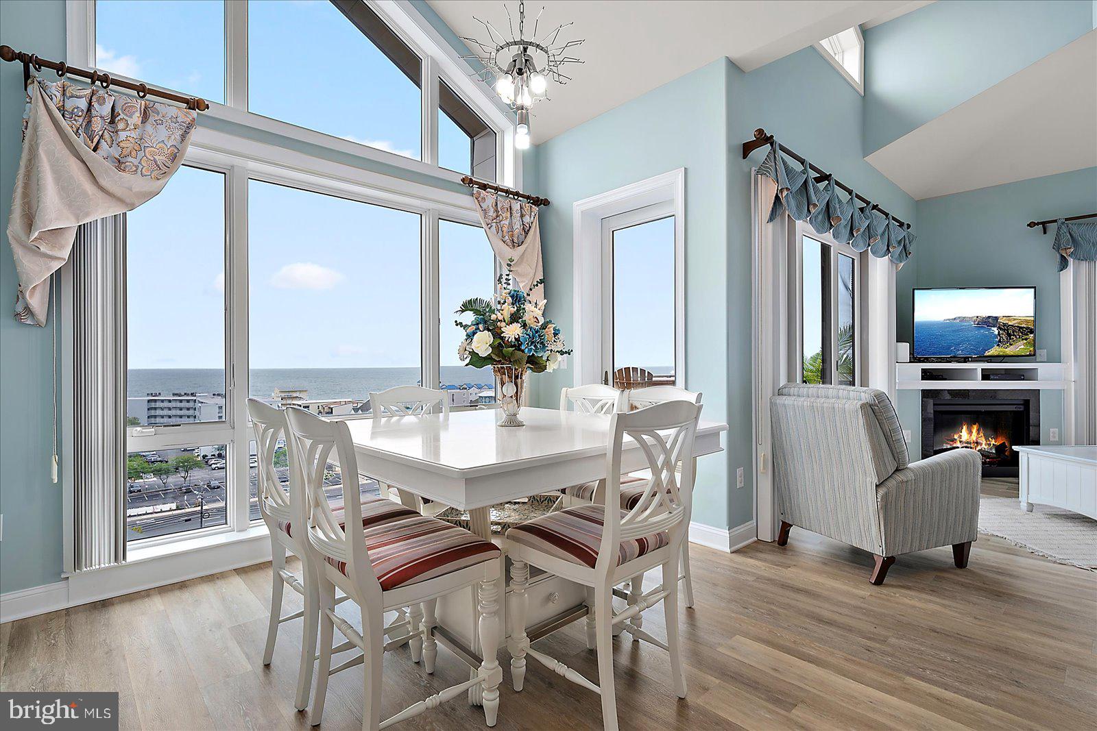 121 81st Street, Unit 907 Ocean City, MD 21842 - Photo 23 of 73 a view of a dining room with furniture window and wooden floor