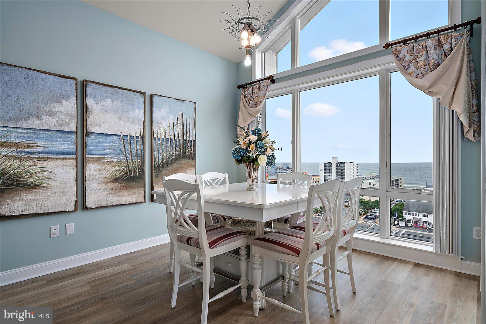 121 81st Street, Unit 907 Ocean City, MD 21842 - Photo 25 of 73 a view of a dining room with furniture window and wooden floor