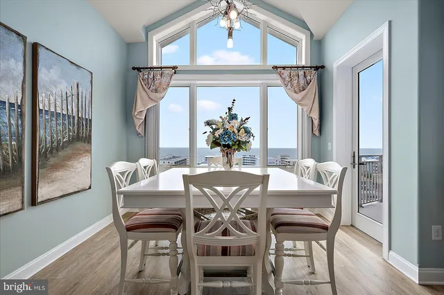 a bathroom with a granite countertop sink a mirror and a shower