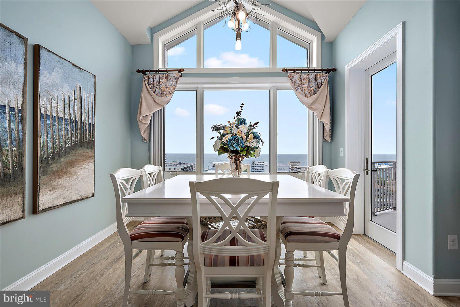 121 81st Street, Unit 907 Ocean City, MD 21842 - Photo 26 of 73 a view of a dining room with furniture window and wooden floor