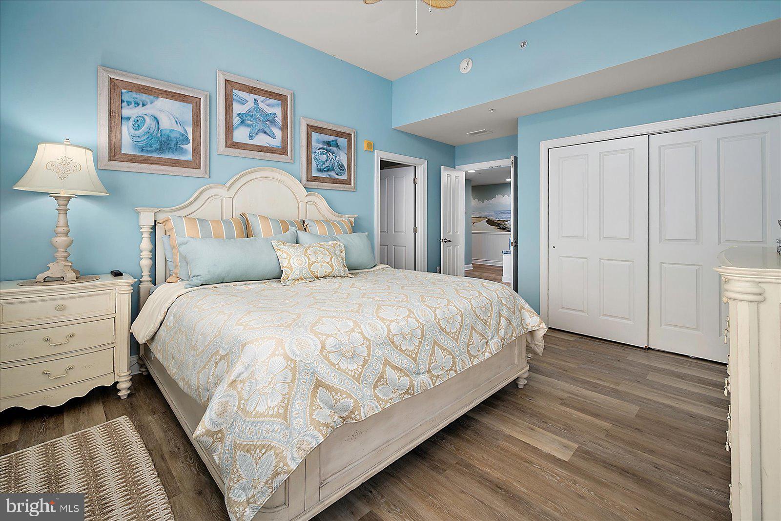 121 81st Street, Unit 907 Ocean City, MD 21842 - Photo 32 of 73 a bedroom with a bed and a painting