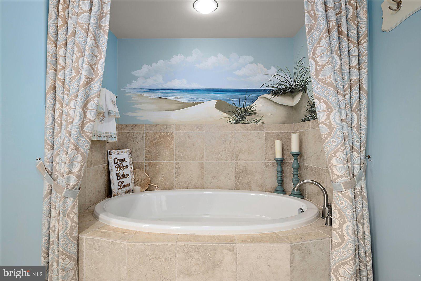 121 81st Street, Unit 907 Ocean City, MD 21842 - Photo 36 of 73 a bathroom with a bathtub