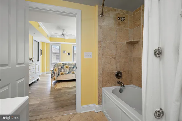 a living room with fireplace furniture and a flat screen tv