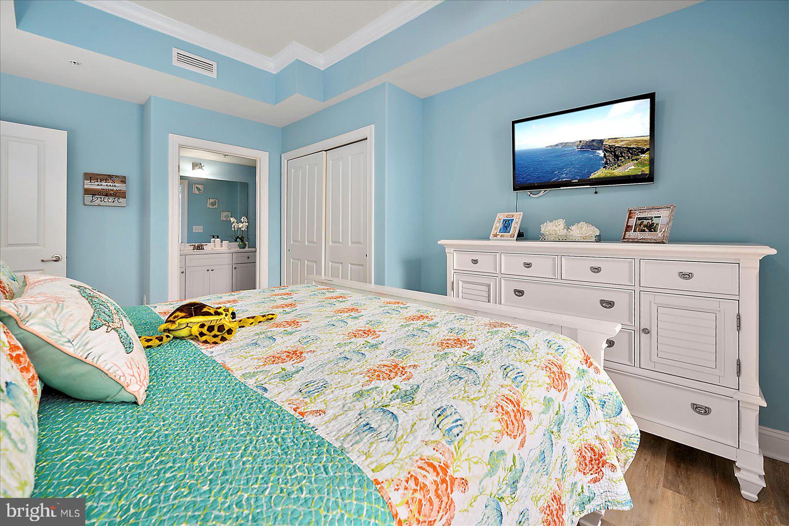 121 81st Street, Unit 907 Ocean City, MD 21842 - Photo 45 of 73 a bedroom with a bed and a flat screen tv