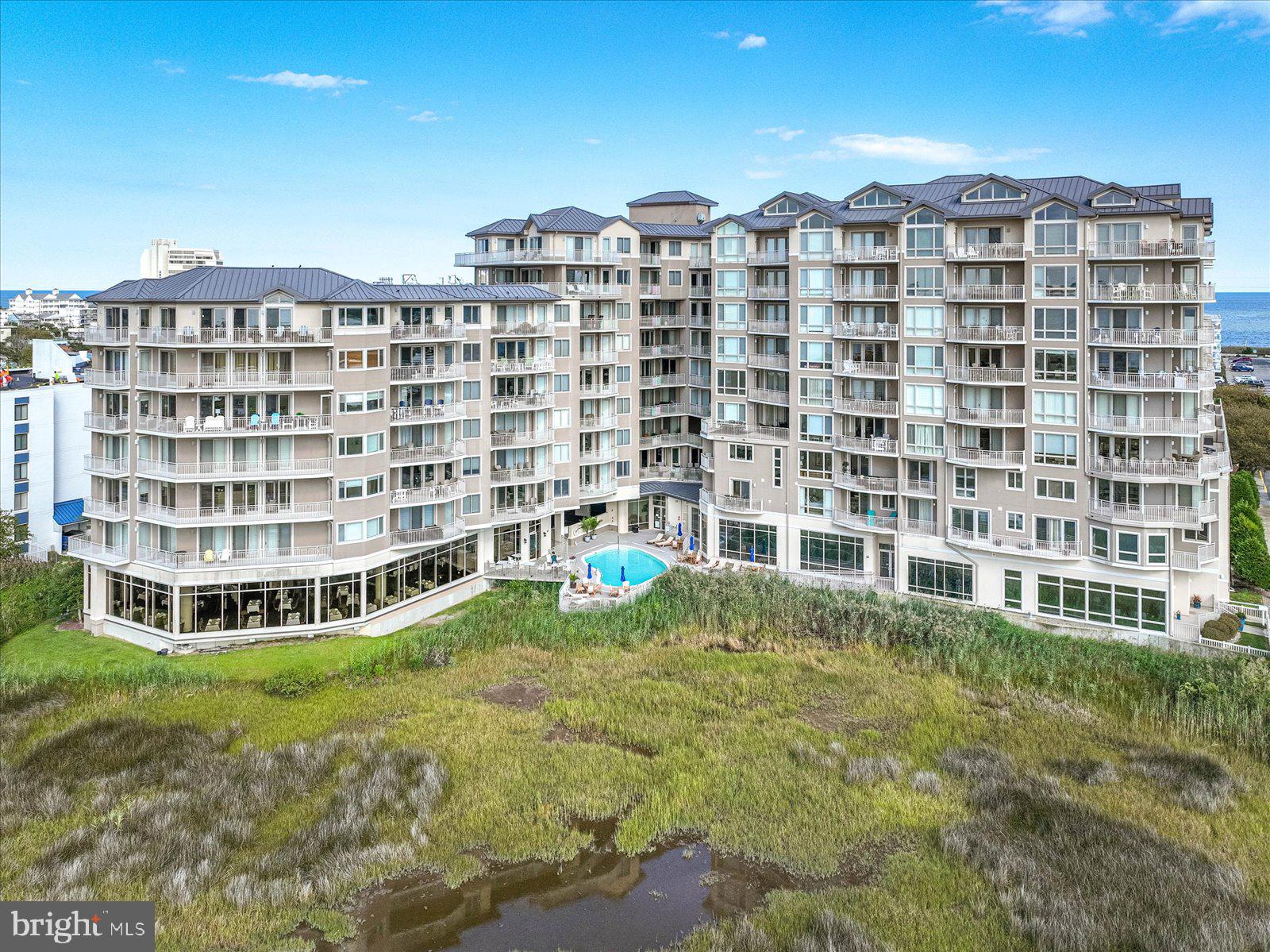 121 81st Street, Unit 907 Ocean City, MD 21842 - Photo 67 of 73 a view of a building with a yard