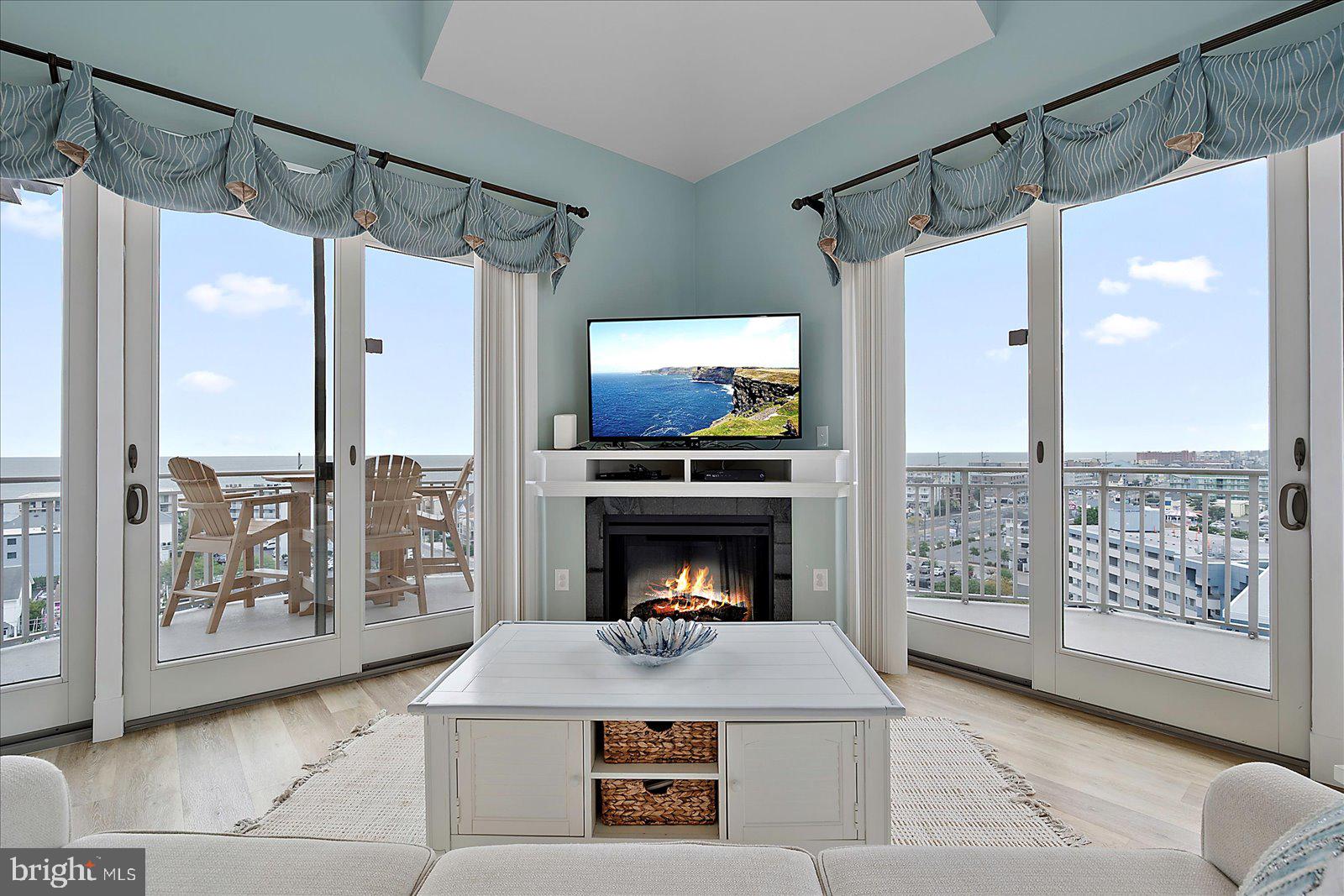 121 81st Street, Unit 907 Ocean City, MD 21842 - Photo 9 of 73 a living room with furniture and a fireplace