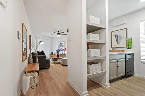 a view of living room with furniture and wooden floor