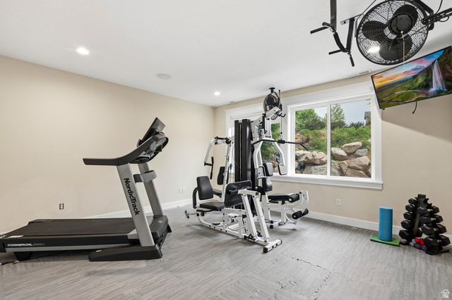 672 Perry Hollow Drive Mapleton, UT 84664 - Photo 77 of 106 Dedicated fitness area featuring light-toned walls, recessed lighting, and a large window offering natural light
