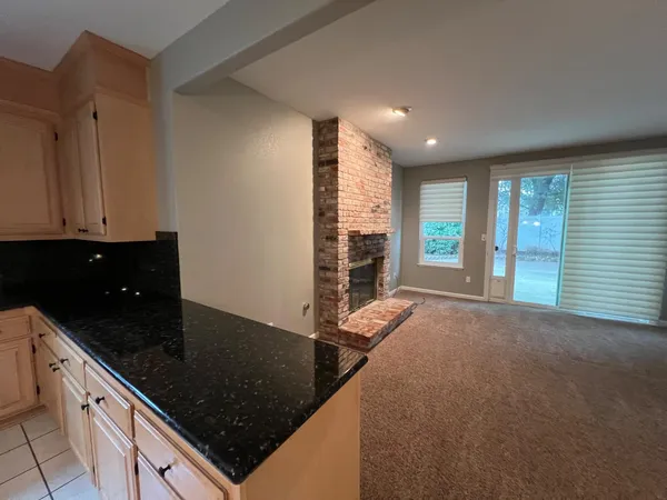 a large kitchen with stainless steel appliances a cabinets and a counter top space