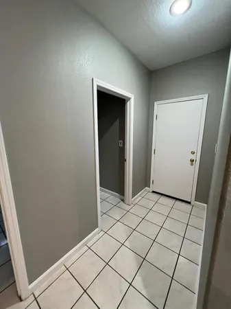 a bathroom with a sink a toilet and a large mirror