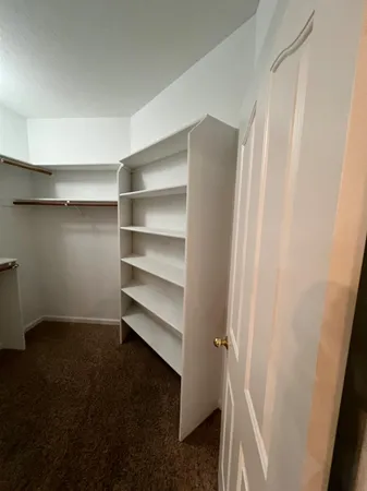 a view of a hallway with toilet