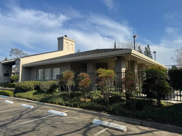 a black and white wall of a black gate