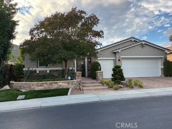 front view of a house with a small yard