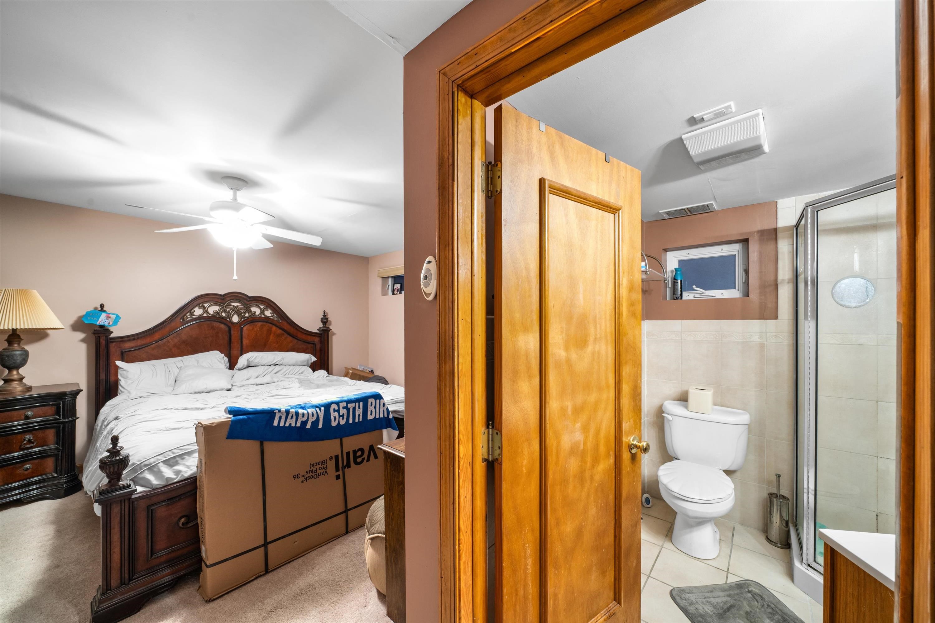 5105 Shawcrest Road, Unit 5105 Wildwood, NJ 08260 - Photo 12 of 31 a en suite bathroom with a granite countertop sink and a mirror