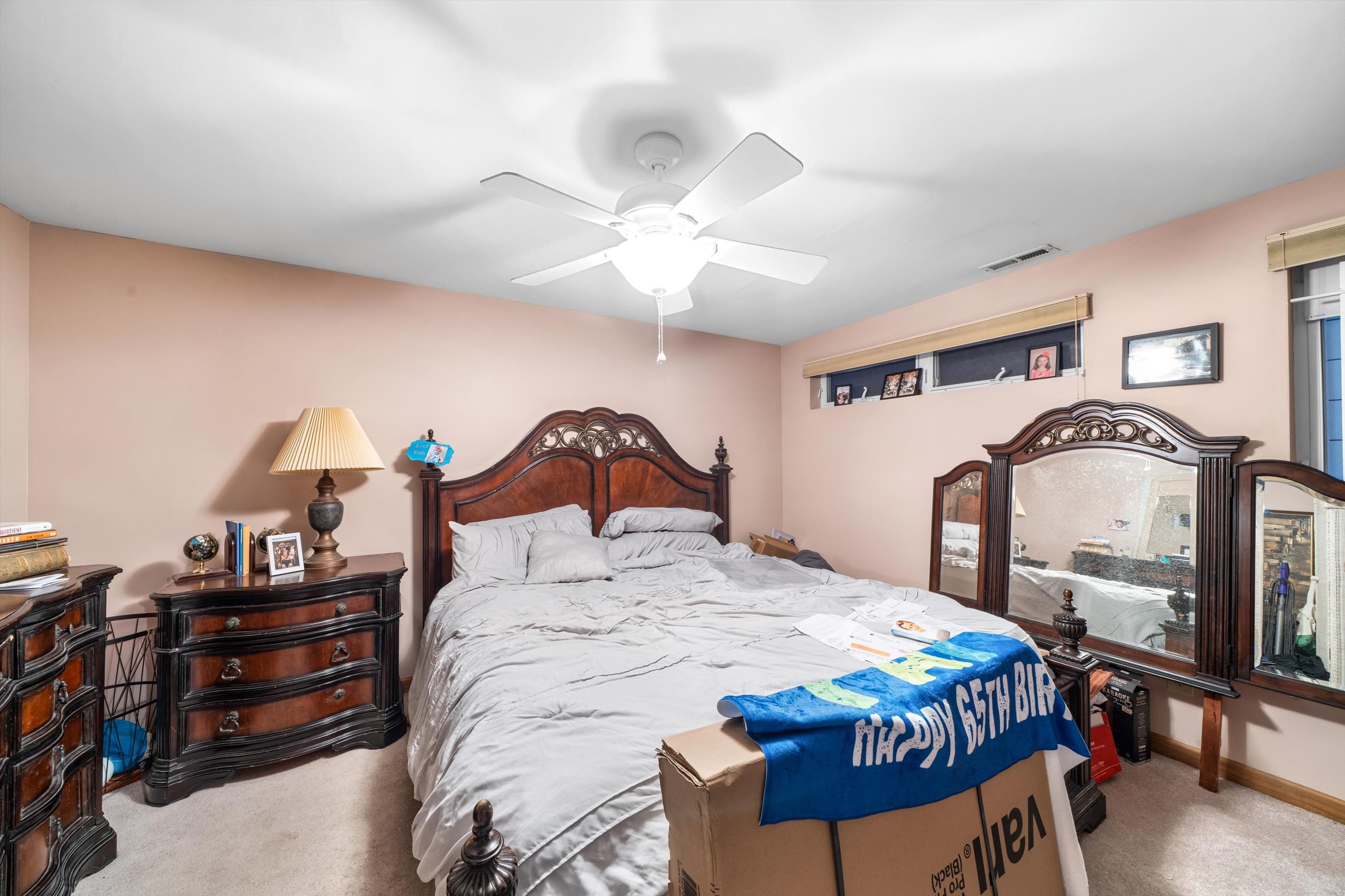 5105 Shawcrest Road, Unit 5105 Wildwood, NJ 08260 - Photo 13 of 31 a bedroom with a bed a dresser and potted plants