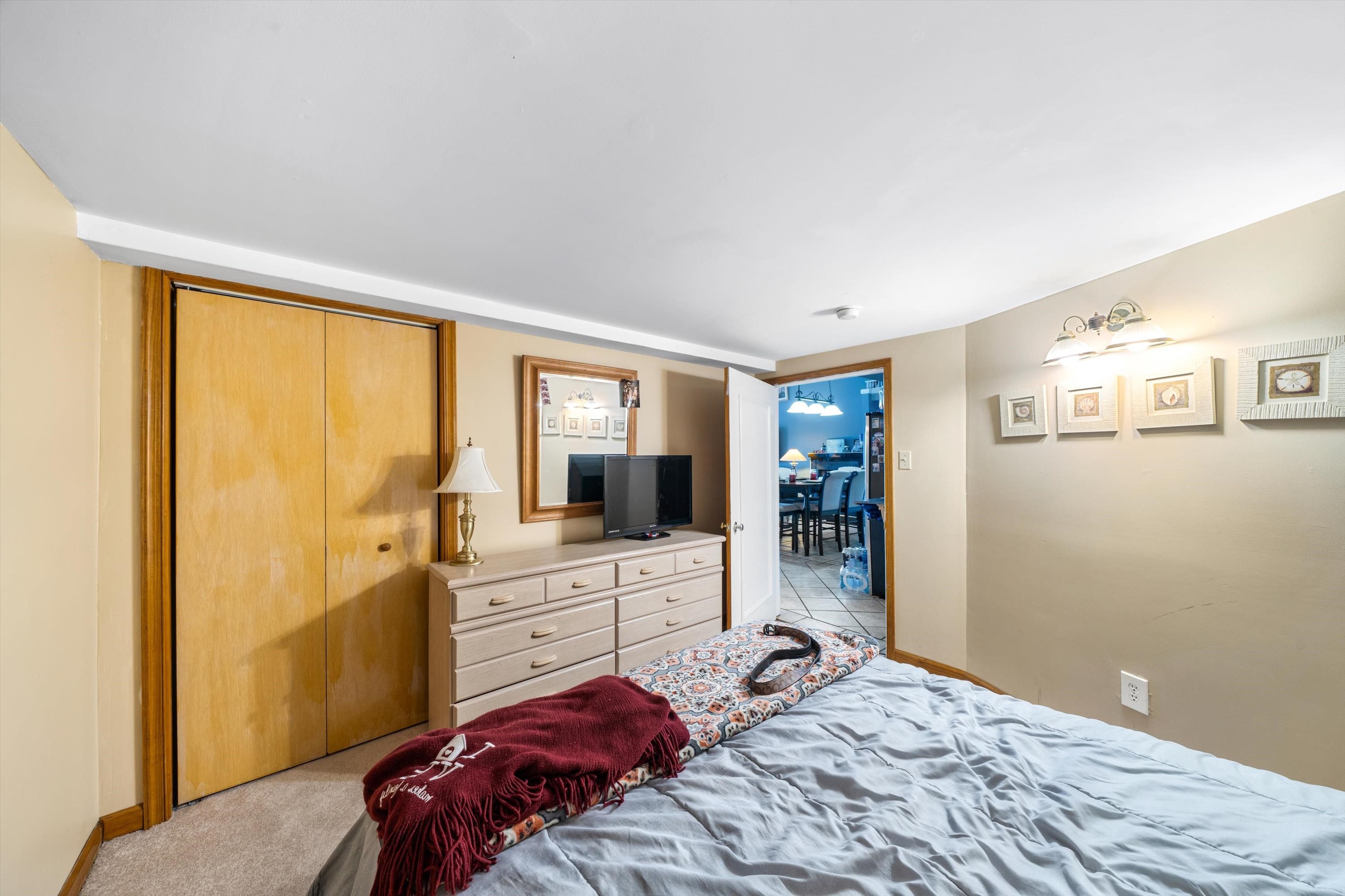 5105 Shawcrest Road, Unit 5105 Wildwood, NJ 08260 - Photo 16 of 31 a bedroom with a bed and a large window
