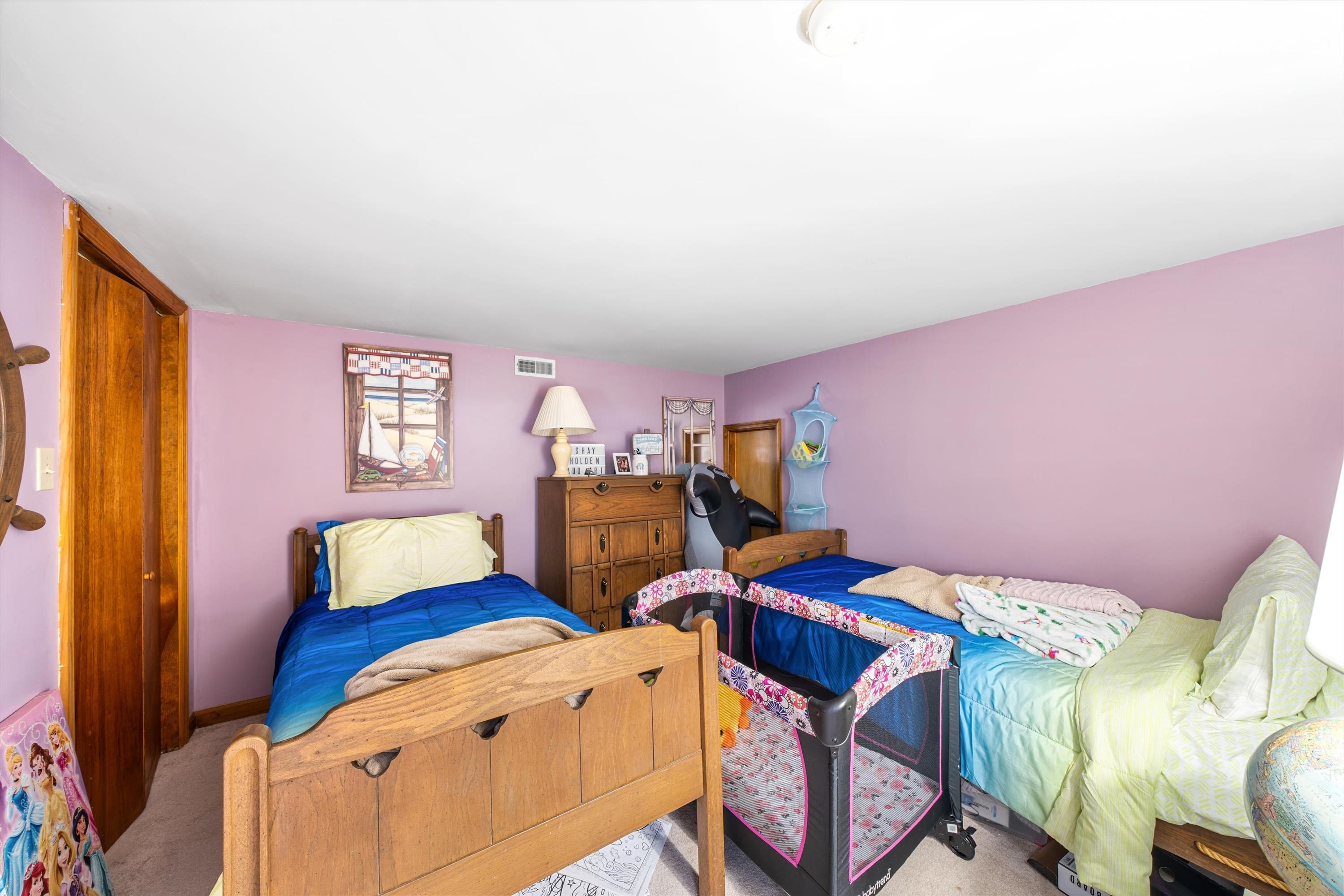 5105 Shawcrest Road, Unit 5105 Wildwood, NJ 08260 - Photo 18 of 31 a bedroom with two beds and a window