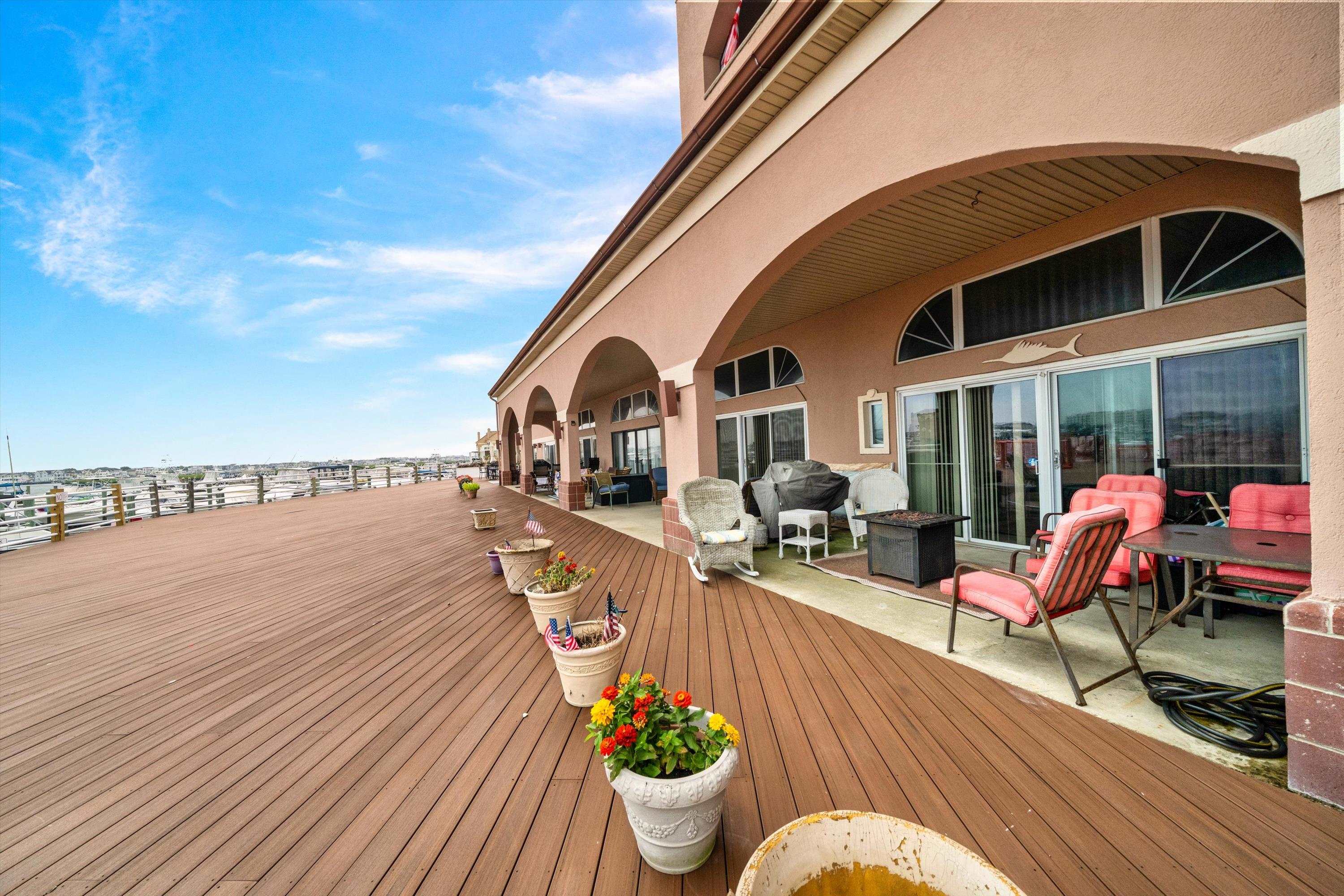 5105 Shawcrest Road, Unit 5105 Wildwood, NJ 08260 - Photo 2 of 31 a view of a patio with couches chairs and potted plants