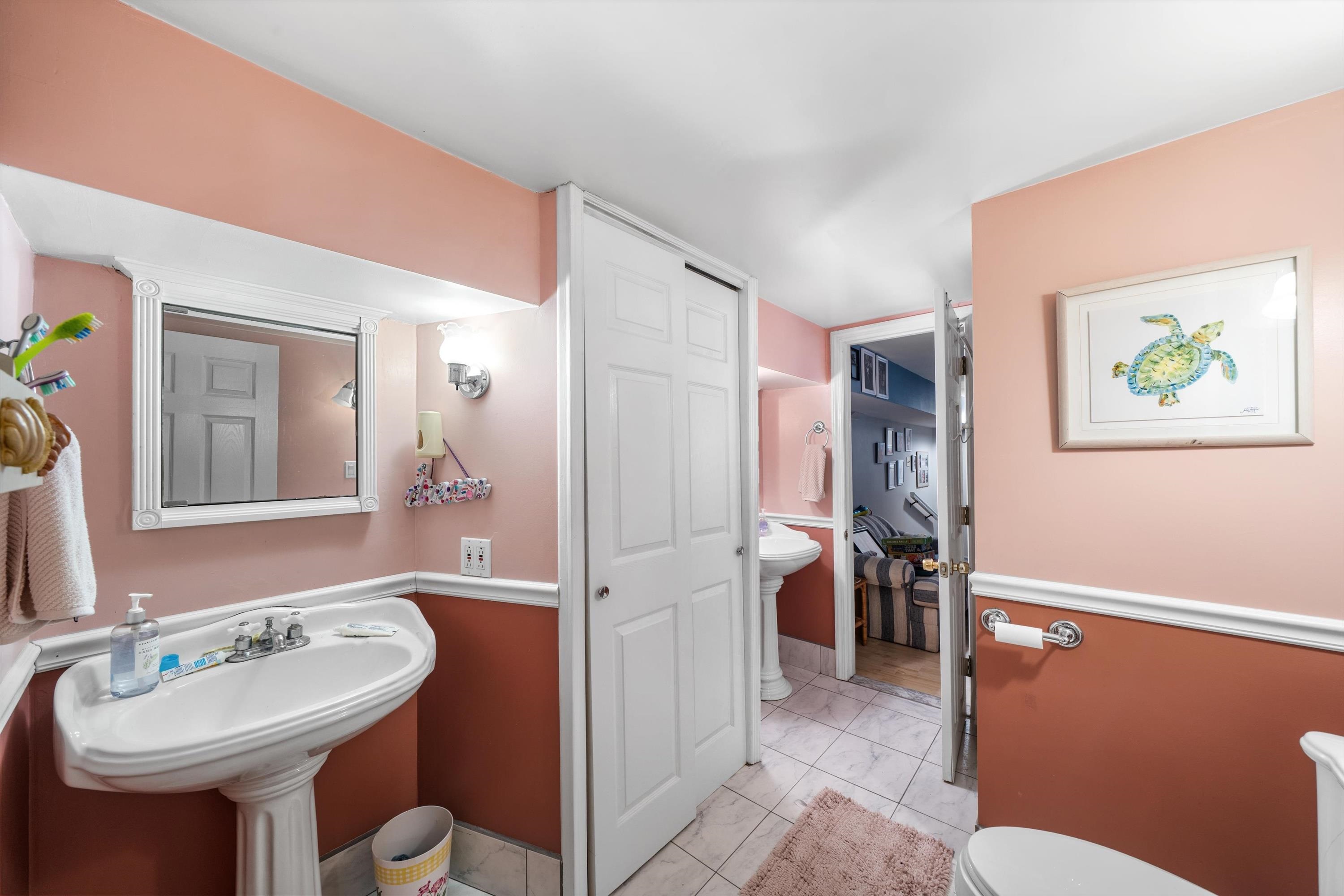 5105 Shawcrest Road, Unit 5105 Wildwood, NJ 08260 - Photo 24 of 31 a bathroom with a sink a toilet and shower