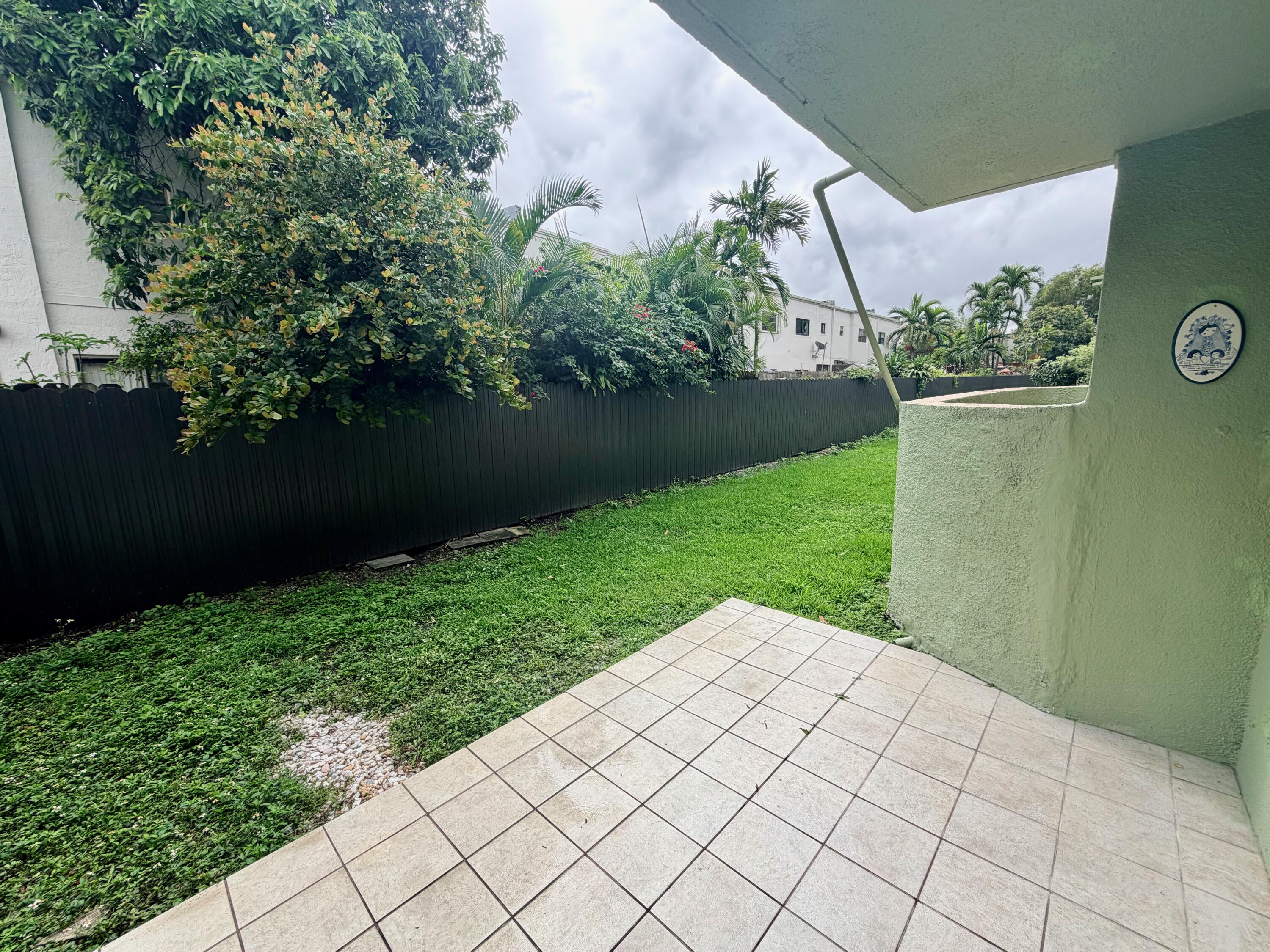 11071 Northwest 7th Street, Unit 104 Miami, FL 33172 - Photo 11 of 30 a view of a backyard with plants
