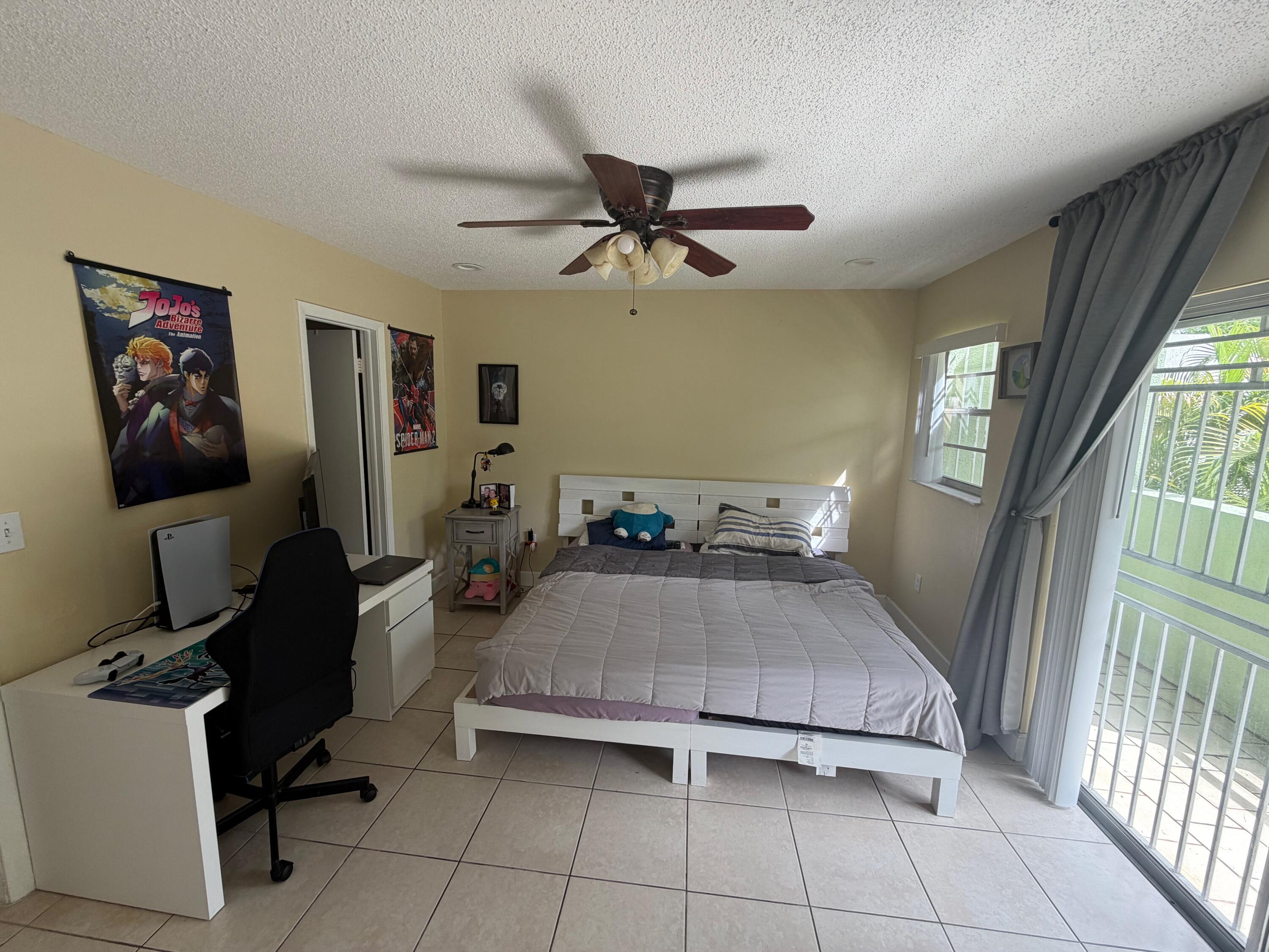 11071 Northwest 7th Street, Unit 104 Miami, FL 33172 - Photo 20 of 30 a bedroom with furniture and window
