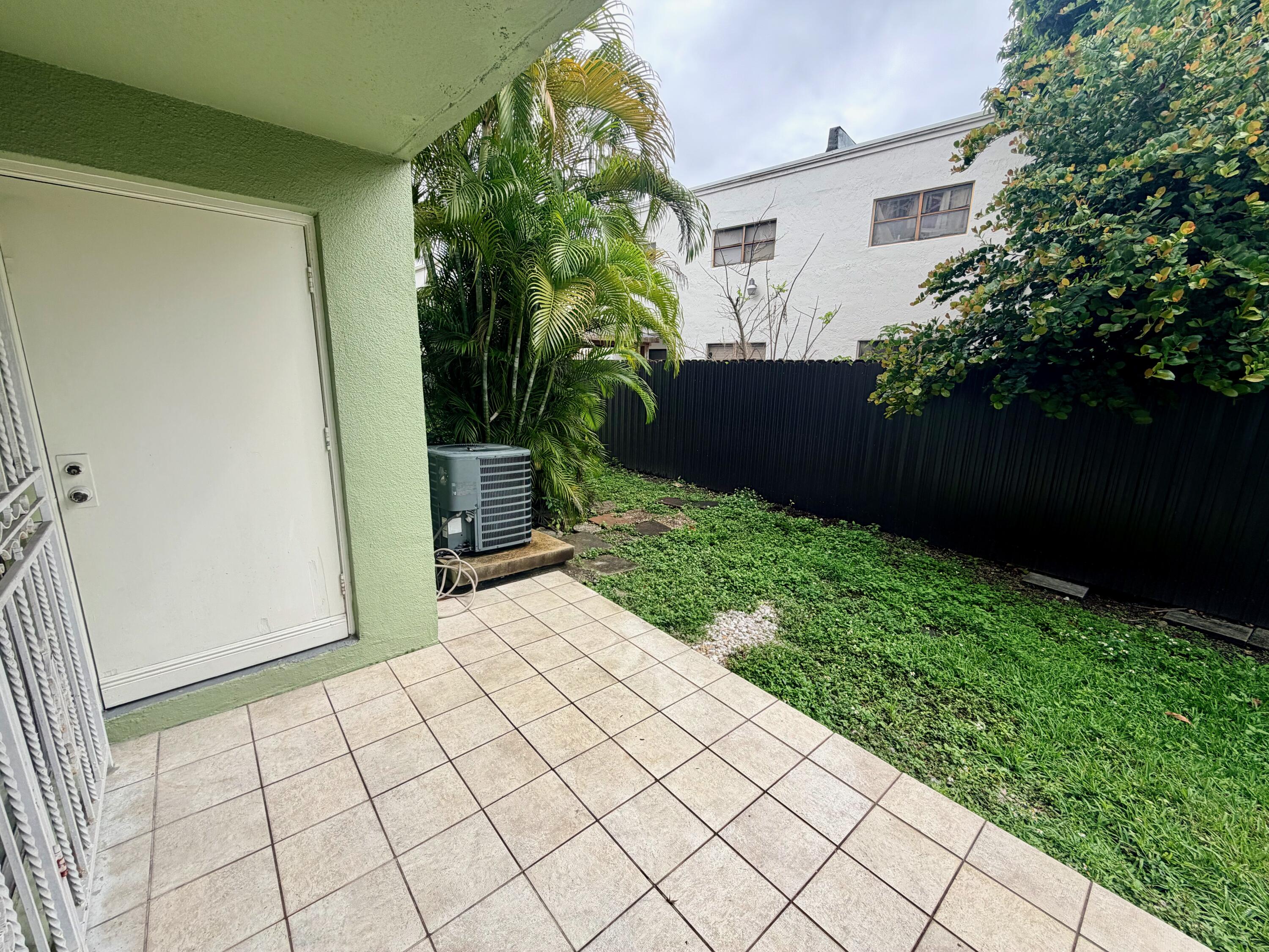 11071 Northwest 7th Street, Unit 104 Miami, FL 33172 - Photo 10 of 30 a view of backyard with potted plants