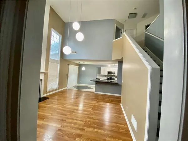 a view of a kitchen from the hallway