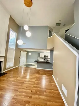 a view of a kitchen with a sink and microwave