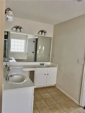 a bathroom with a sink a vanity and a mirror