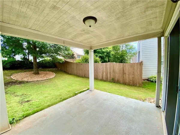 a view of a swimming pool with a patio
