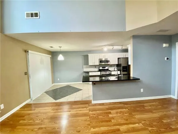 a view of a living room with a flat screen tv