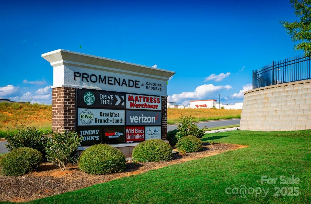 2182 Flicker Road, Unit 1036B Indian Land, SC 29707 - Photo 12 of 17 a view of a sign board with a big yard