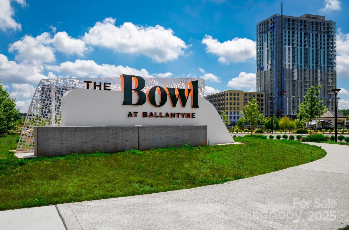 2182 Flicker Road, Unit 1036B Indian Land, SC 29707 - Photo 15 of 17 a view of a park with of a apartment building in the back