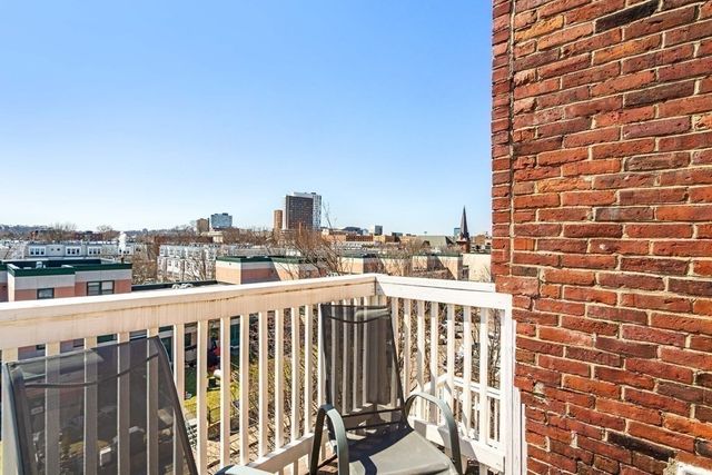 a view of a balcony with city view